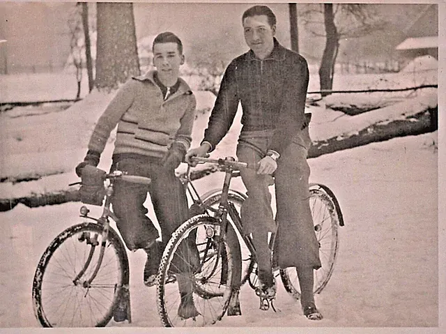 Dapper Young Men on Thin Tire Touring Bicycles in Snow-Photograph
